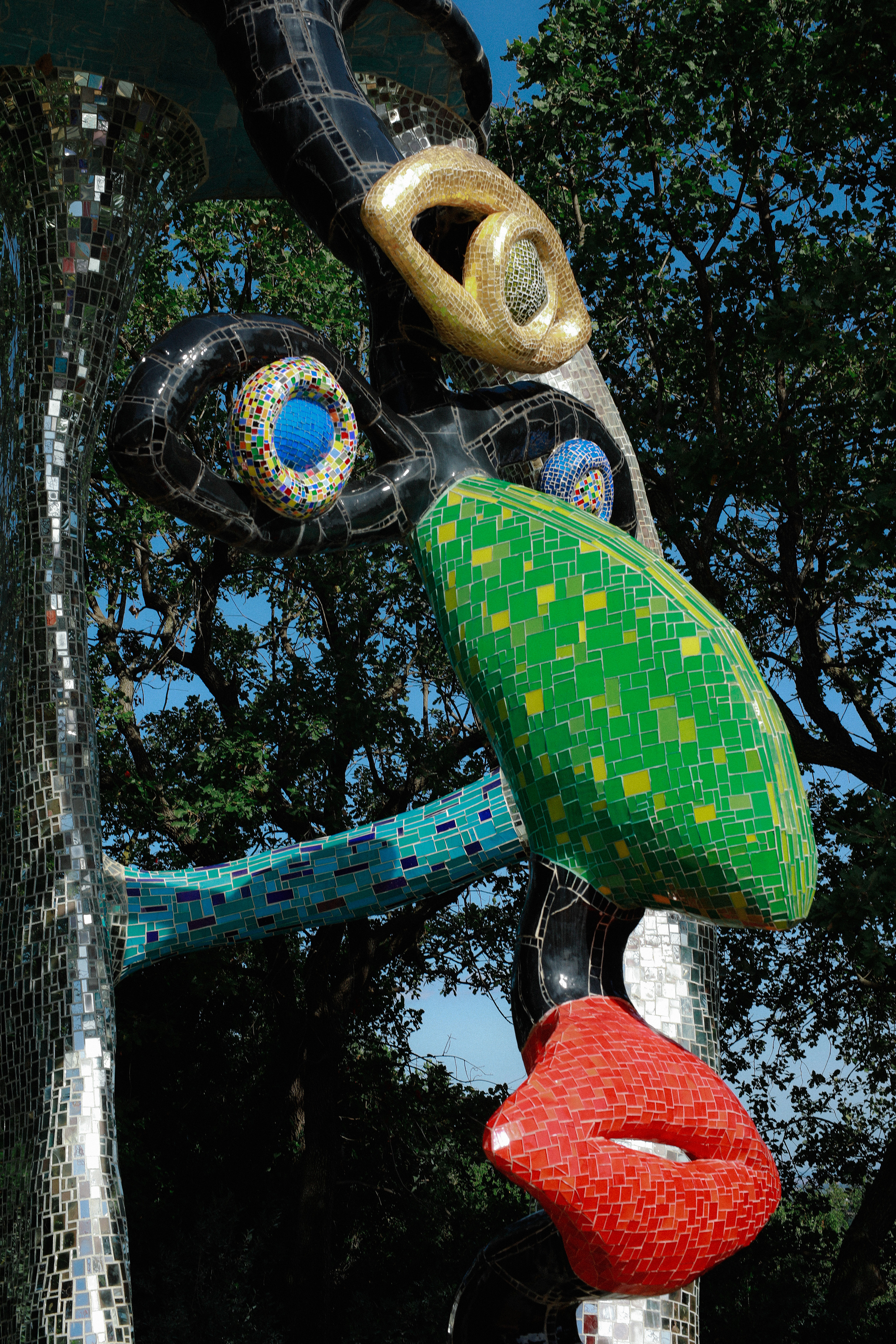 A colorful mosaic serpent figure in the Tarot Garden