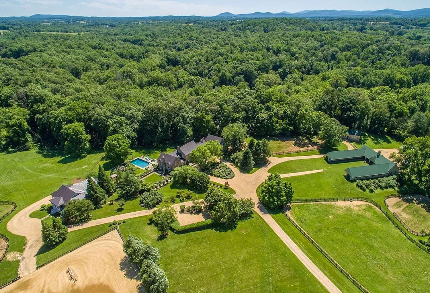 The Middleburg equine estate surrounded by pasture and woodland