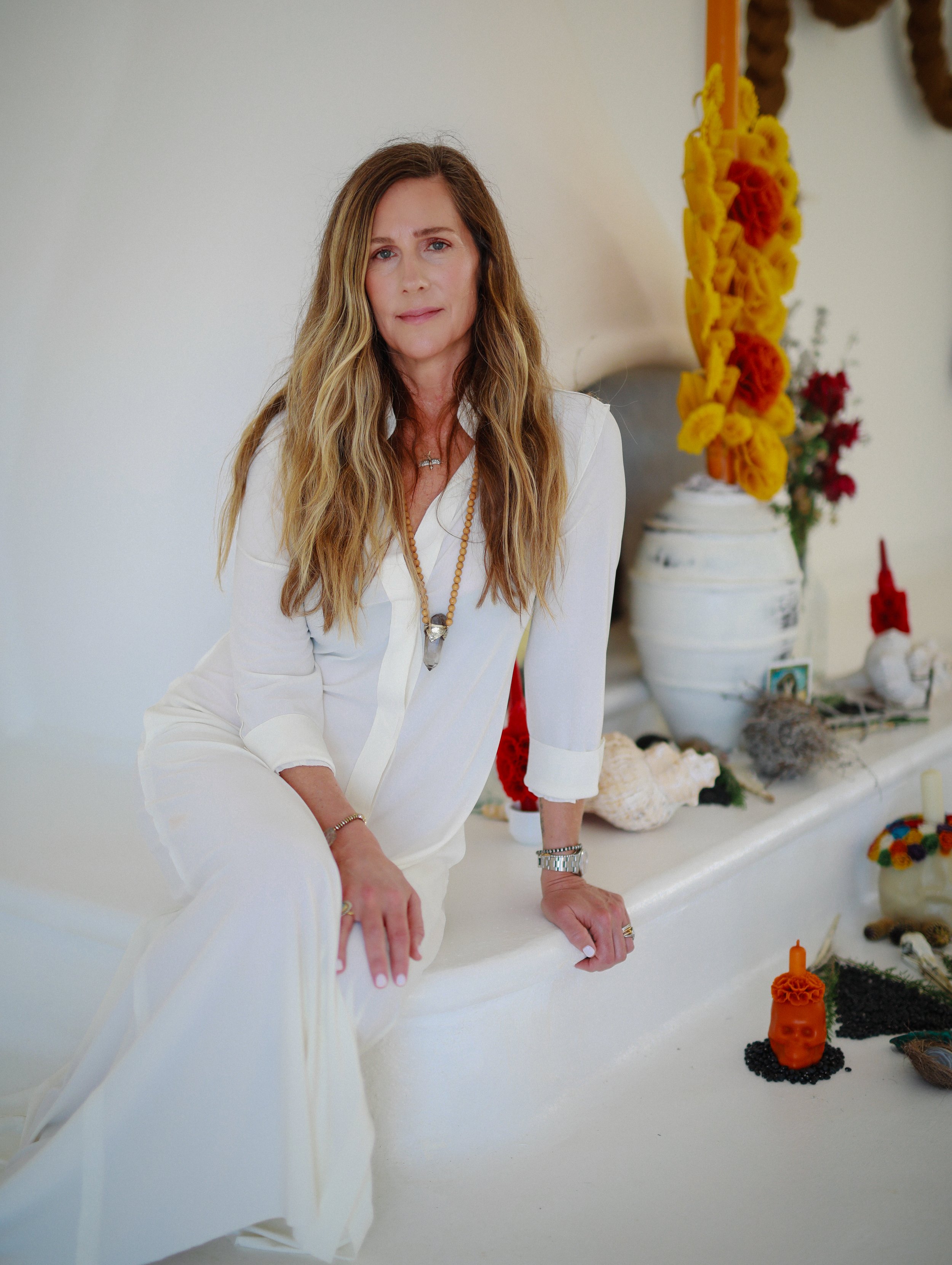 Lindsay Olshan in a white dress