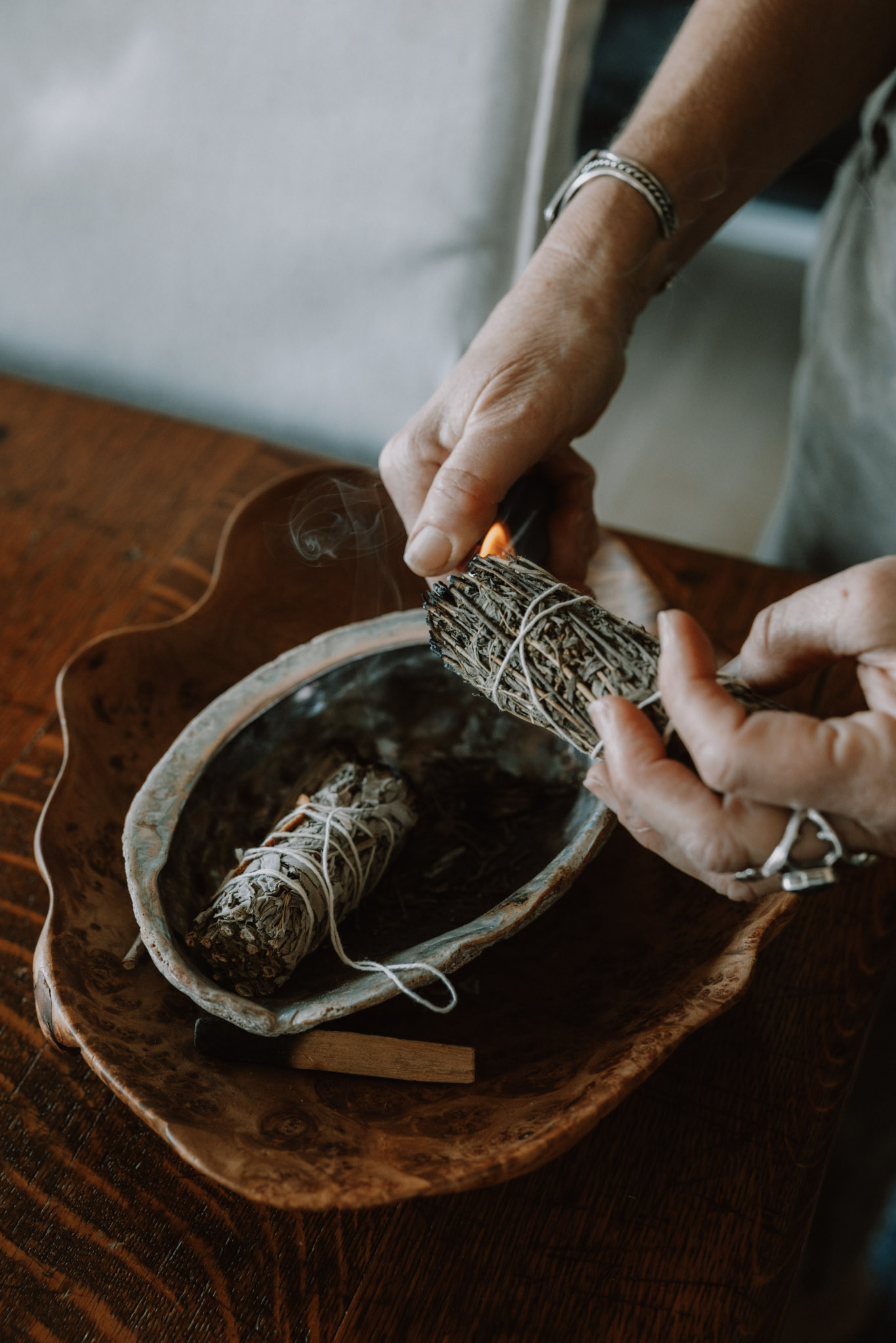 Hands preparing herbs with care